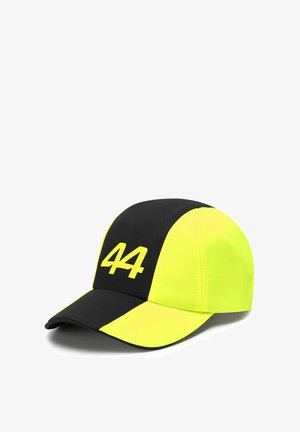 Czapka z jasnocz yellow przodem i czarnymi bocznymi panelami, z dużą białą cyfrą "44" wyraźnie widoczną na przodzie. Miękki materiał, zakrzywiony daszek.