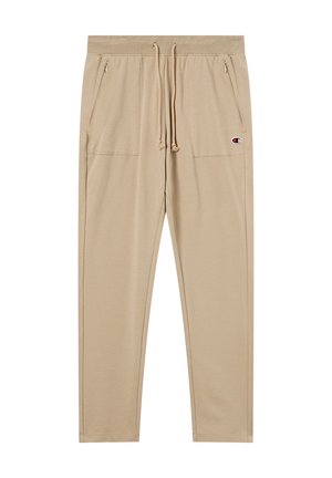 Beige taps toelopende sweatpants met koord in de taille, ritszakken aan de zijkant en een klein Champion-logo op de bovenste linkerdij.