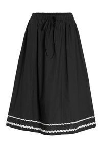 Svart kjol med elastiskt midjeband och justerbar dragsko; har ett vitt zigzagmönster längs fållen. Slät textur.