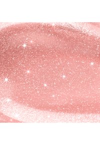 Paillettes scintillantes en or rose avec des reflets lumineux étincelants sur une surface lisse et scintillante.