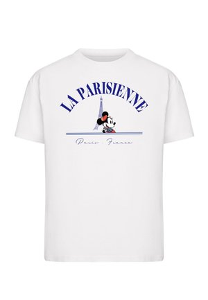 Camiseta de algodón blanca con el texto "LA PARISIENNE", gráfico de la Torre Eiffel y un personaje de dibujos animados con un lazo rojo, con acentos en azul y negro.