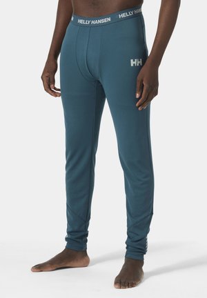 Herren-Thermoleggings in Türkis mit Stretchpassform. Sie verfügen über einen strukturierten Stoff, Helly Hansen-Logo am Bund und an der Seite.