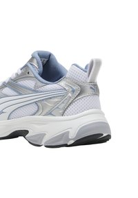 White sneaker with mesh and silver synthetic accents, featuring a padded tongue, rounded toe, and black rubber outsole.