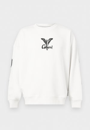 Sweat-shirt à manches longues blanc avec une figure ailée noire et le mot "Colcci" imprimés au centre de la poitrine.