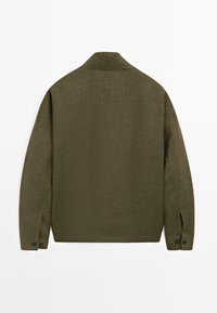 Olive green long-sleeve shirt jacket with buttoned cuffs, textured check pattern, and a classic collar shown from the back.