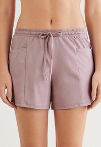Lichtpaarse short gemaakt van een katoenen mix, met een elastische tailleband met aantrekkoord en twee zijzakken.
