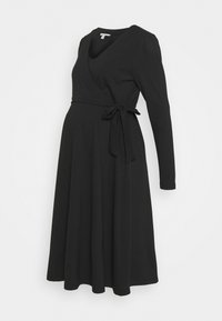 Vestido de maternidad negro con manga larga, escote en V y lazo en la cintura. Hecho de una tela suave, con una falda fluida para mayor comodidad.