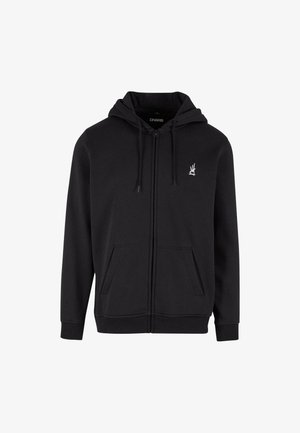 Czarna bluza rozpinana wykonana z miękkiego materiału. Posiada kaptur ze sznurkiem, przednie kieszenie oraz małe białe logo na piersi.