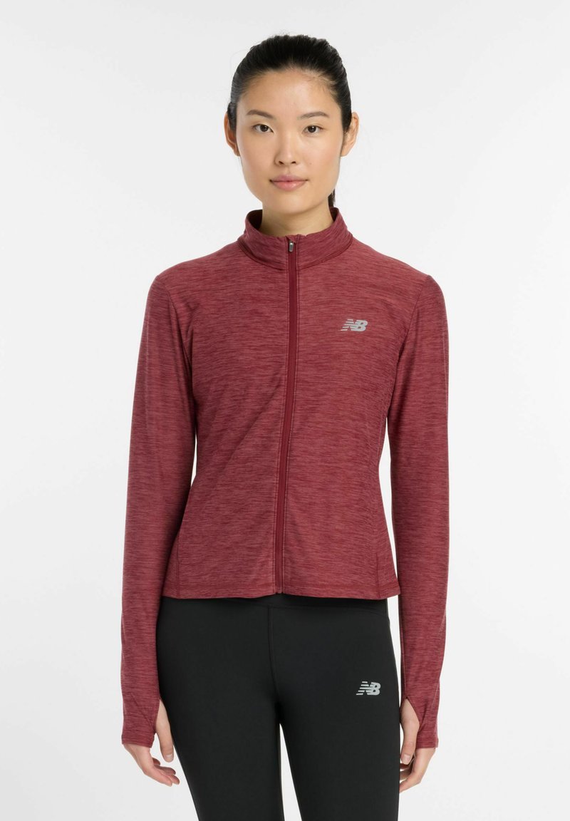 Maroon athletic jacket with a high collar, full zip, and long sleeves; features a textured fabric and reflective logo detail on the chest.