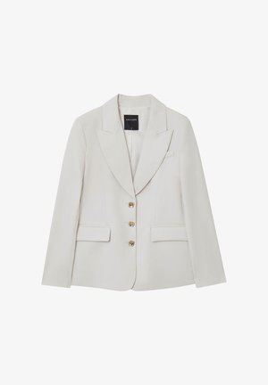 Blazer beige avec une coupe ajustée, devant croisé, revers crantés, accents de boutons dorés et deux poches avant. Tissu au toucher lisse.