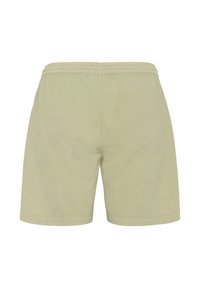 Svjetlo bež kratke hlače dužine do koljena s elastičnim pojasom, prikazane s leđa, izrađene od lagane tkanine.