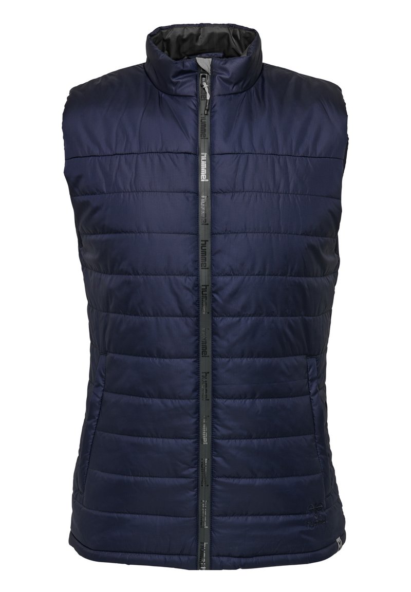 Gilet sans manches matelassé bleu marine avec col montant et fermeture zippée à l'avant, présenté sur fond blanc.