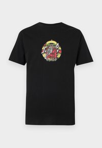 Black cotton t-shirt with short sleeves featuring a colorful printed skeletal figure in a sombrero design in the center.