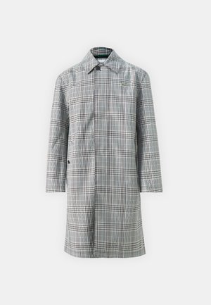 Dolga, siva plašč iz kariranega vzorca s ovratnikom, ki ima gumbasto zapiranje, dve stranski žepni in subtilen logotip. Material se zdi gladek in lahek.