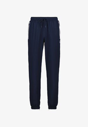 Marineblauwe sweatpants met een elastische tailleband, trekkoord en taps toelopende boorden. Bevat witte zijstrepen en een klein logo op het linkerbeen.