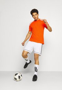 adidas Performance SQUAD 21 - Camiseta estampada - teaora/white