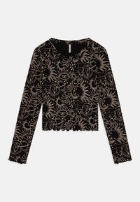 Svart langermet crop topp i ribbet stoff med et gyldent himmellegeme-mønster av sola, måner og øyne. Bølgeformet kant og detaljer i halslinjen.