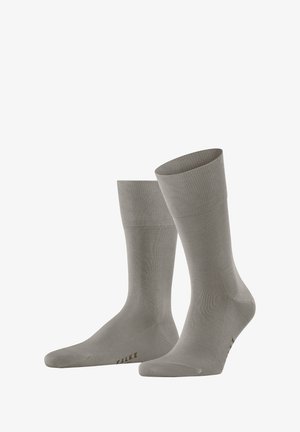 Gray cotton blend socks with ribbed cuffs, smooth texture, and reinforced toe. Features the brand name "FALKE" on the side.