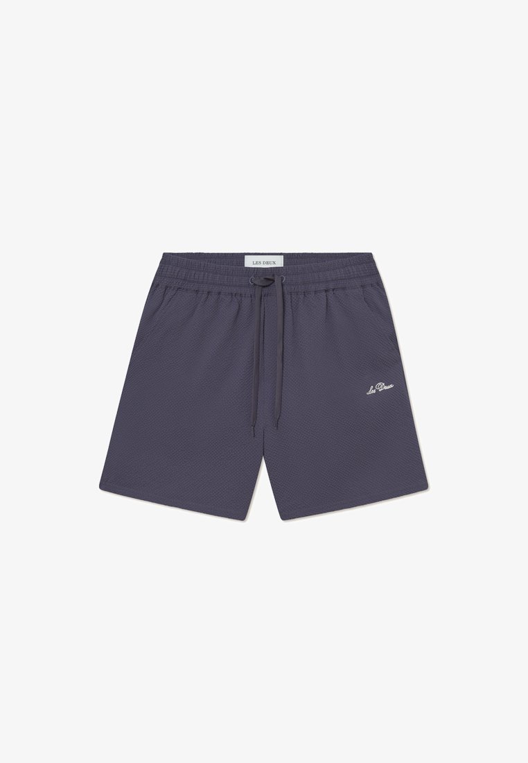 Navy blue shorts made of textured fabric, featuring an elastic waistband with drawstring and a small white logo on the lower left leg.
