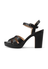 Sandal con tacco alto nero, con ampie cinghie incrociate, fibbia alla caviglia e suola piattaforma chunky. Texture in pelle liscia e design robusto.
