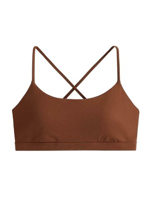 Ruskea urheiluliivit, joissa on ohuet hihnat ristissä selän puolella, saumaton muotoilu ja leveä alarinnan tukivyö.