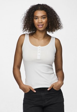 White ribbed tank top with a round neckline and button detailing at the front, paired with black high-waisted pants.