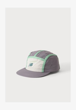 Light purple and white New Balance running cap with green trim and stitched logo on the front panel, set against a white background.