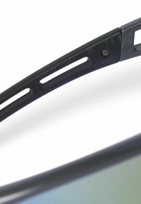 Sunglasses with black plastic frames, feature ventilation holes in the temples, and green tinted lenses. Markings indicate CE certification.
