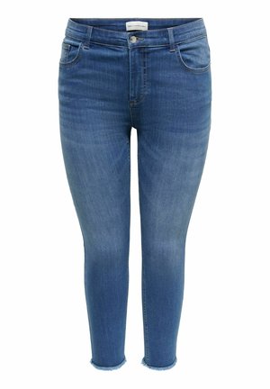 Kék szűk farmernadrág öt zsebbel, fém gombos záródással és rojtos szegélyekkel, testhezálló, bokáig érő fazonban.