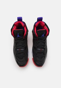Black high-top sneakers with red and purple accents, featuring a textured leather upper, prominent lacing system, and rubber soles.