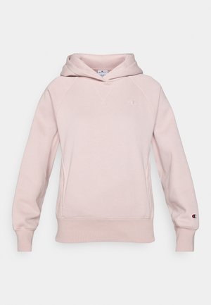 Light pink hoodie made of soft fabric with a front pocket, raglan sleeves, and logo on the chest and sleeve. Features a drawstring hood.