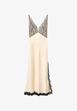 Satin nightdress in cream with a black lace bodice and trim. V-neckline and adjustable straps. Floor-length with side lace detailing.