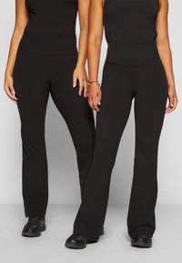 Athleta ELATION FLARE PANT - Leggings - black