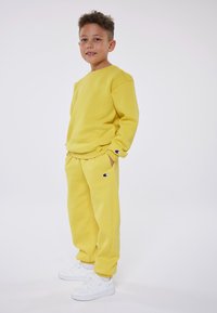 Champion EXCLUSIVE PANT UNISEX - Treniņtērpa apakšdaļas - yellow