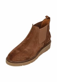 Brown suede ankle boot with elastic side panels, round toe, textured sole, and stitched detailing along the sole edges.