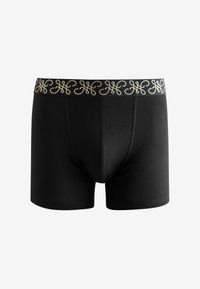 Bóxer negro confeccionado en un material elástico, con una cinturilla decorativa de patrón dorado y un diseño ajustado.