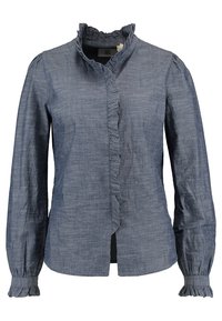 Blouse bleu marine à manches longues, avec un col volanté et une patte de boutonnage, dotée de poignets froncés et d'un motif de tissu texturé.