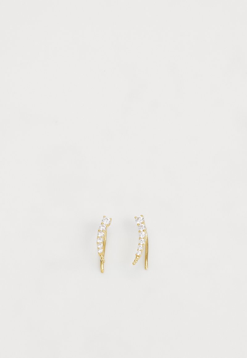 Guldörhängen med två böjda former, prydda med flera små klara kristaller längs ena sidan. Släta ytor med en glänsande finish.