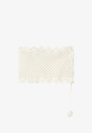 Haut bandeau blanc crocheté avec des bords festonnés et un lien avec détail pompon suspendu sur le côté droit.