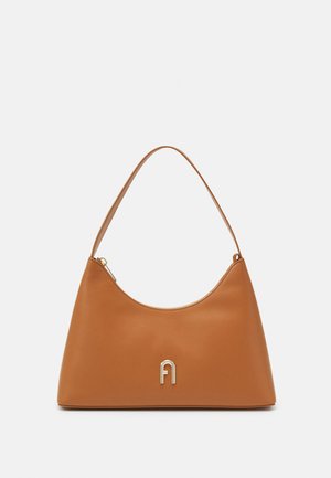 Brown leather handbag with a curved silhouette, a single shoulder strap, and a gold-tone logo detail on the front. Smooth texture.