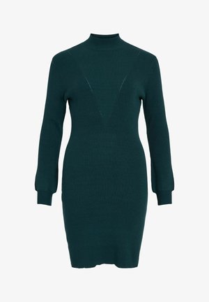 Dunkelgrünes geripptes Strickkleid mit langen Ärmeln, hohem Hals und figurbetontem Schnitt, das ein dezentes dreieckiges Rippenmuster auf der Brust aufweist.