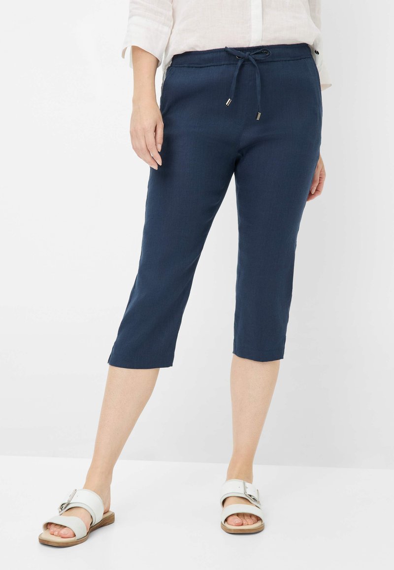 Pantaloni blu navy a vita alta con elastico e coulisse. Tessuto leggero, progettati con una vestibilità comoda, con un orlo rifinito.
