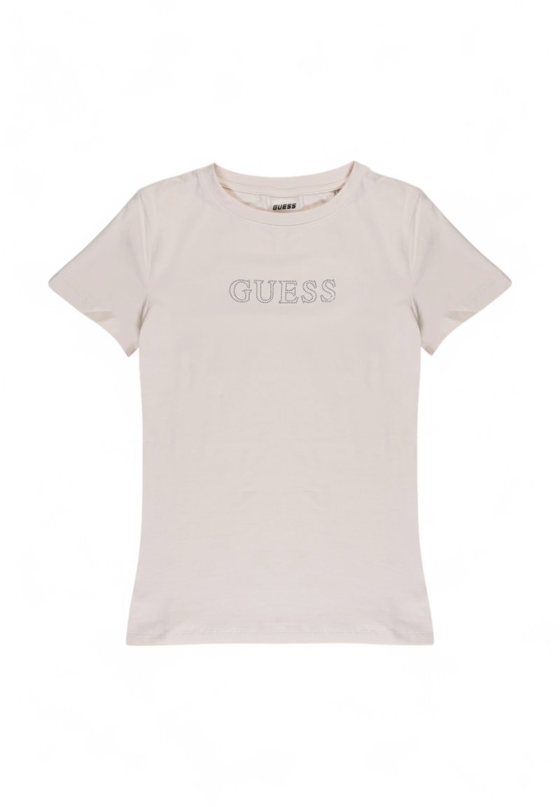 Lichtbeige t-shirt gemaakt van zachte katoen. Geribbelde ronde halslijn, korte mouwen, met het 'GUESS' logo in zilveren studs gecentreerd op de borst.