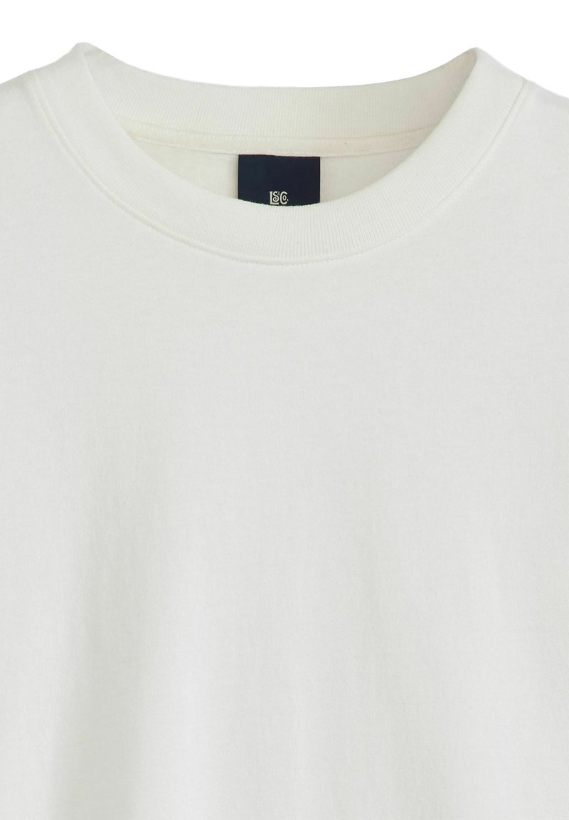 White cotton sweatshirt with a round neckline and ribbed trim. Features a soft texture and an inner label visible inside the collar.