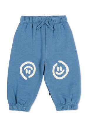 Pantalon bleu pour tout-petit avec taille et poignets élastiqués, cordon de serrage et deux motifs de visages souriants blancs sur les genoux.