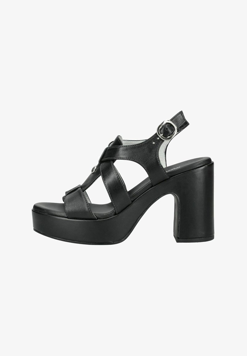 Sandale à plateforme en cuir noir avec larges brides croisées, bout ouvert, boucle ajustable à la cheville et talon haut épais.