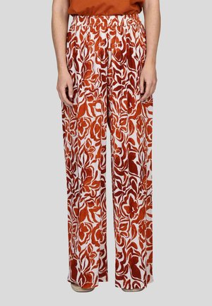 Pantalons larges à imprimé florale avec une taille élastique. Conçus en rouge et blanc, présentant une texture douce et une coupe ample.