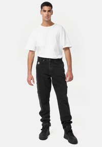 Karl Kani RETRO TAPERED WORKWEAR - Laisvo kirpimo džinsai - vintage black