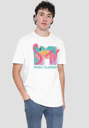 White cotton t-shirt featuring a colorful retro MTV logo with a pink flamingo design, short sleeves, and a casual fit.