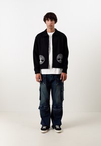 Don't Waste Culture REZO UNISEX - Laza szabású farmerek - dark blue
